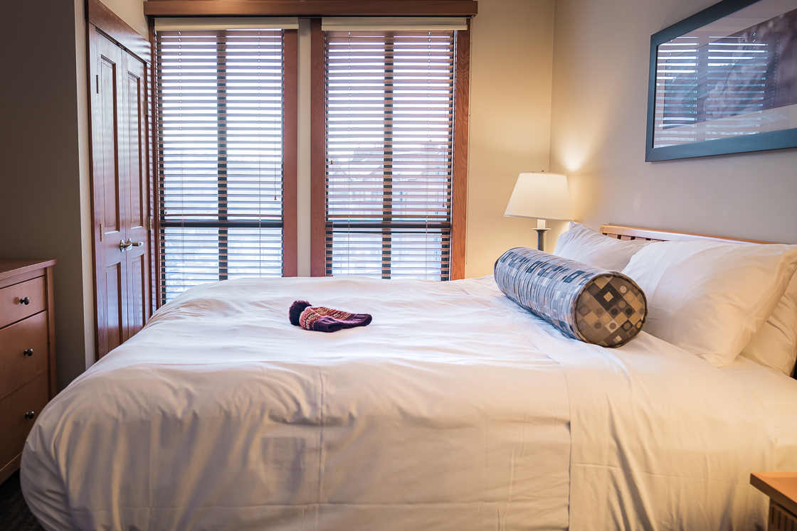 Bedroom at the Pan Pacific Whistler Mountainside Hotel