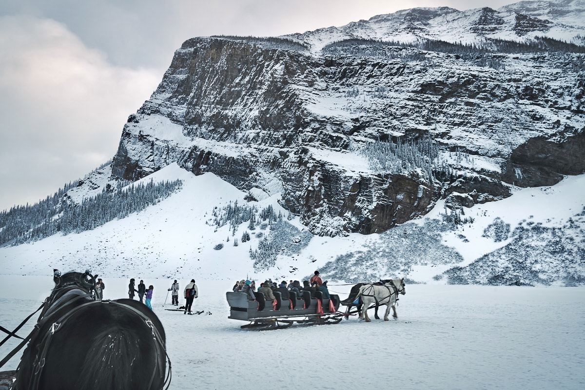 Sleighs and horses on frozen Lake Louise