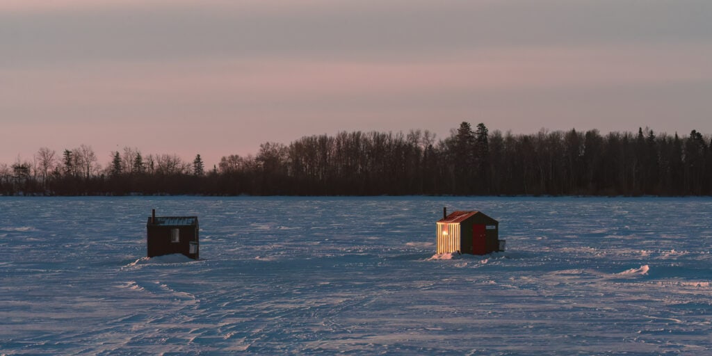 sunrise ice fishing shacks Lake Winnipeg